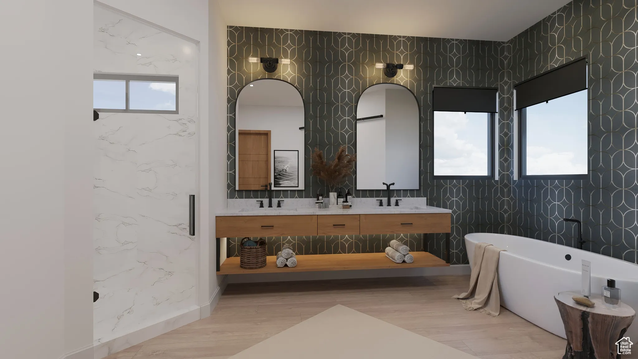 Bathroom featuring a freestanding tub, double vanity, tile walls, and wood finished floors
