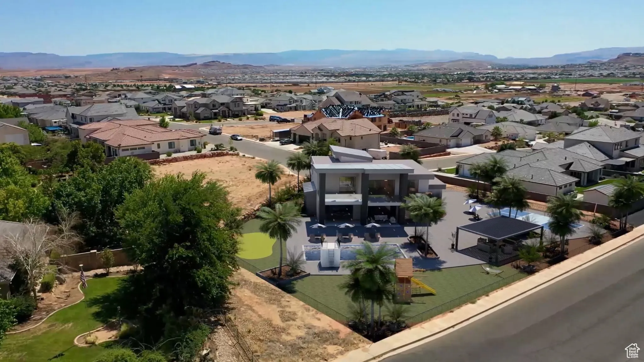 Aerial view of residential area featuring a mountainous background
