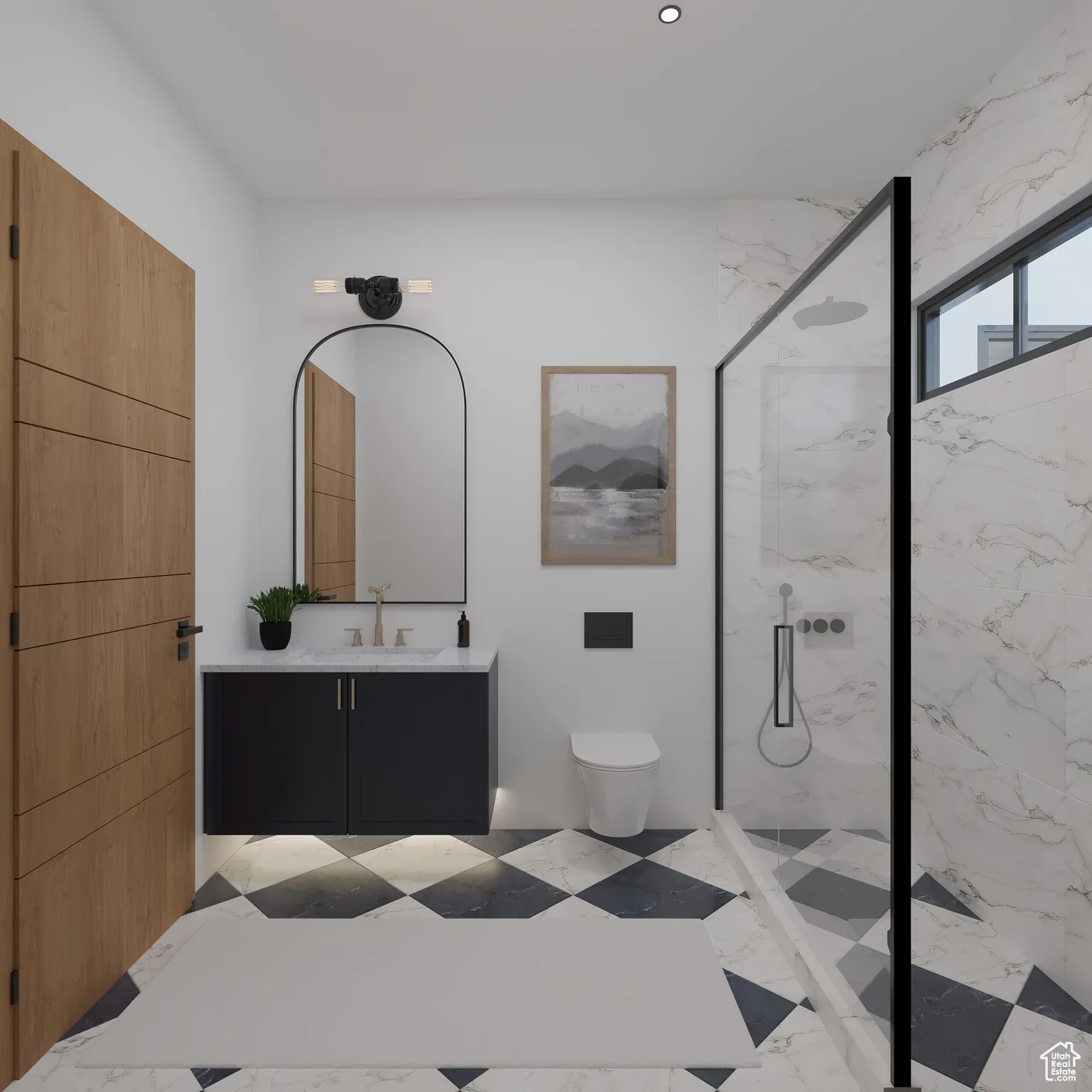 Bathroom featuring a marble finish shower and vanity