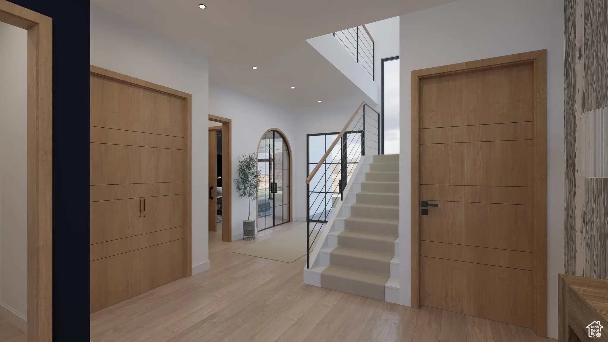 Foyer featuring stairway, light wood-type flooring, and recessed lighting