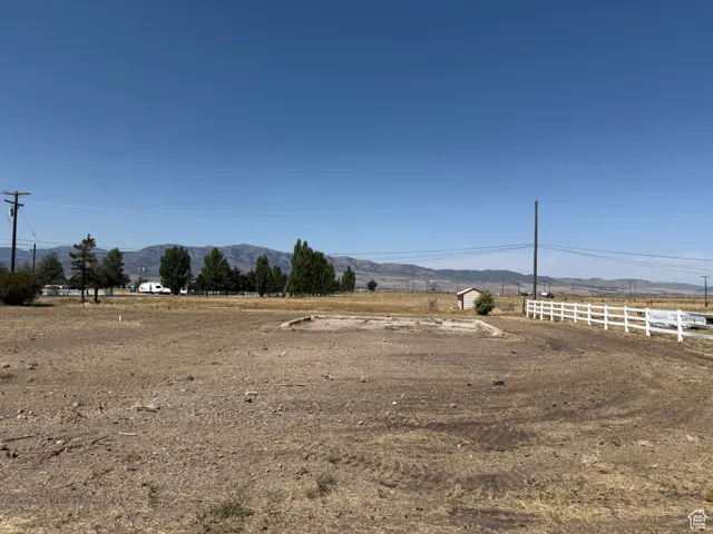 View of yard with a mountain view and a view of countryside