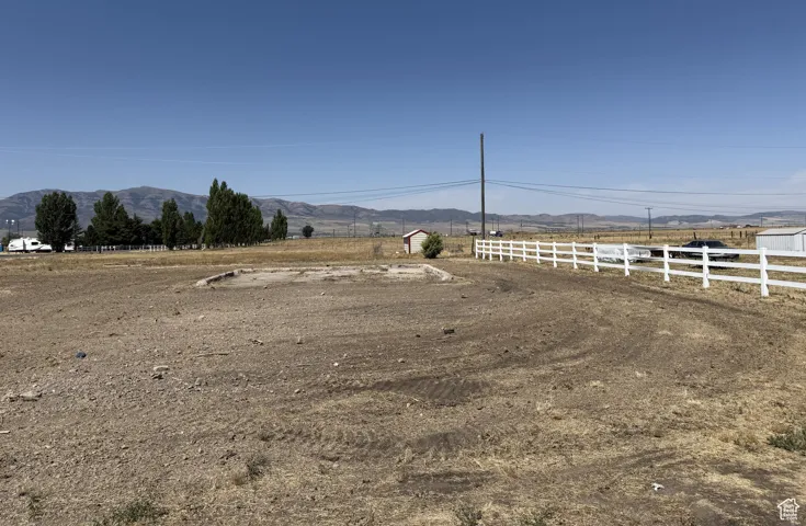View of yard featuring a view of countryside and a mountain view