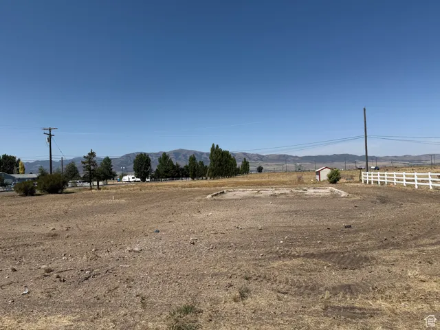 View of yard with a mountain view and a view of rural / pastoral area