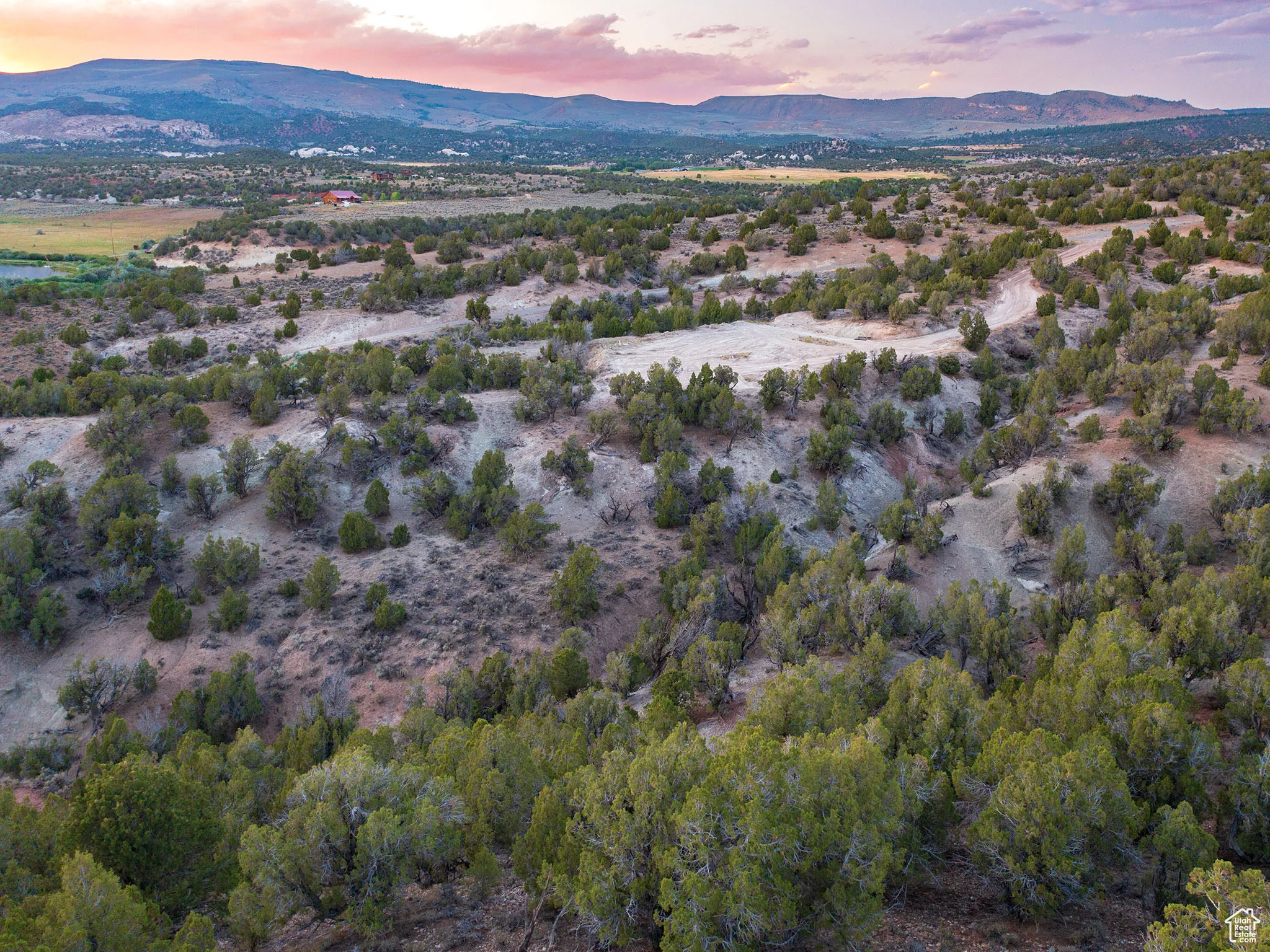 Aerial view at dusk of a mountain view, a view of countryside, and view of desert