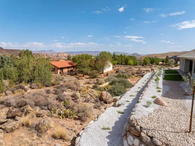 View of terraced rear lot and natural terrain.