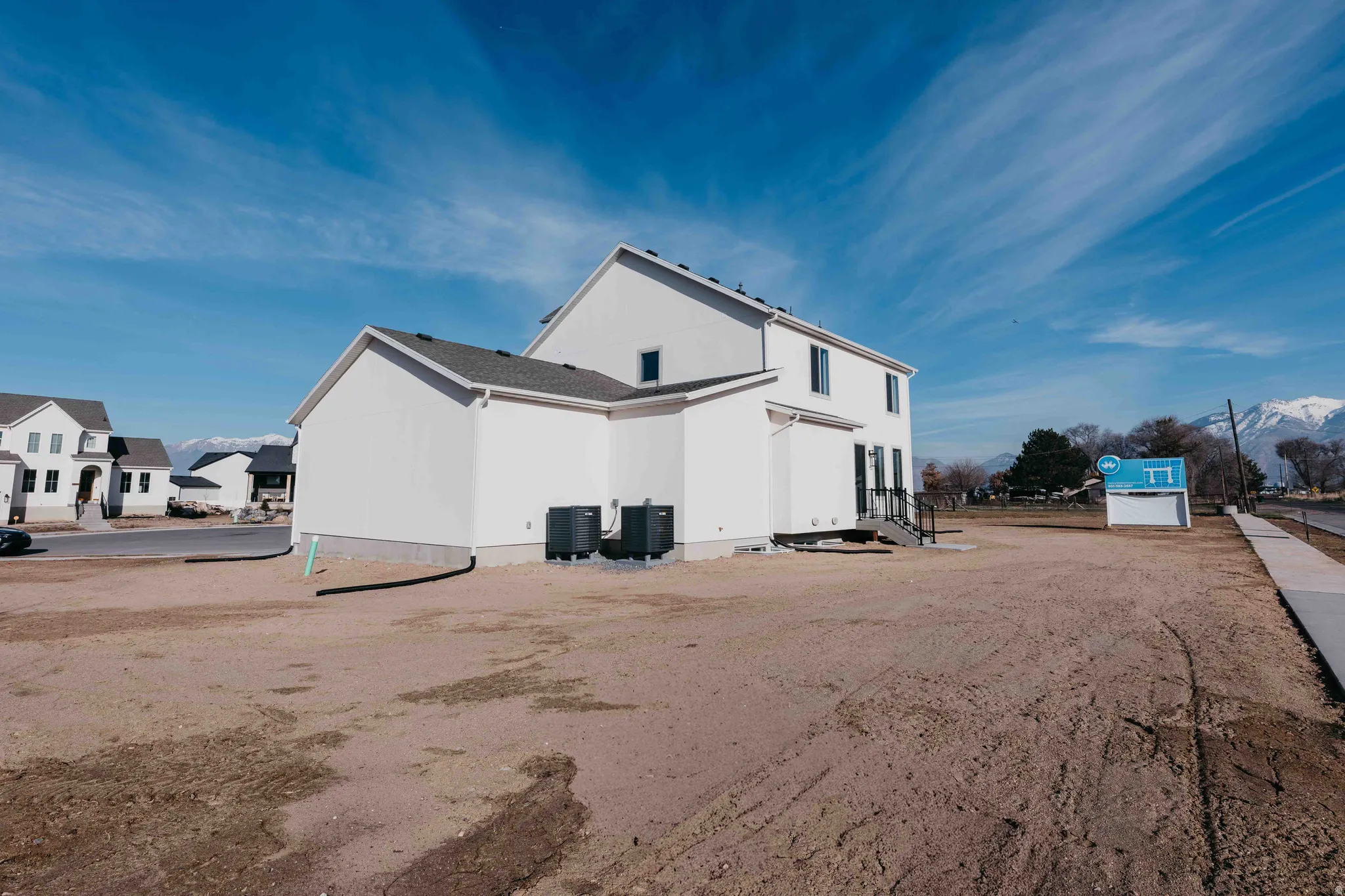 View of property exterior featuring a central AC unit