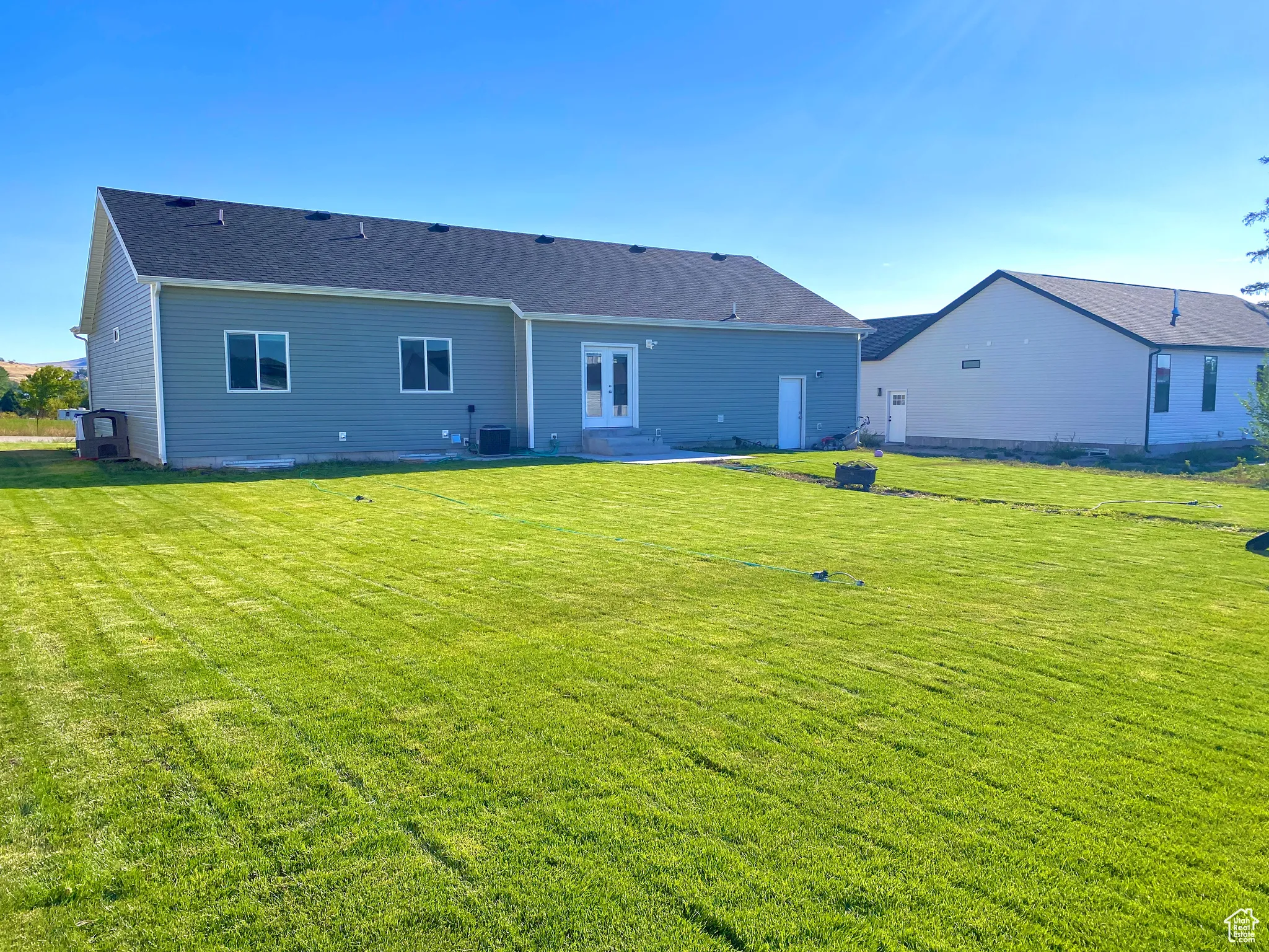 Rear view of house faces North.  .29 acres lot with plenty of space between houses on the sides.