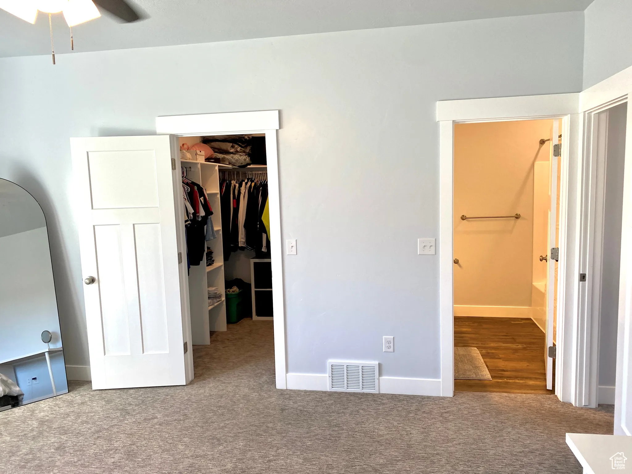 Primary bedroom with walk-in closet and full primary bathroom.