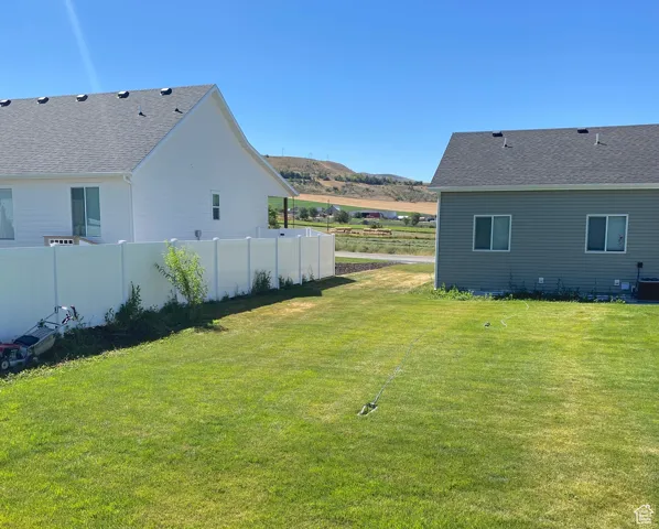 Backyard and view of the east side, towards the open field and mountain range.