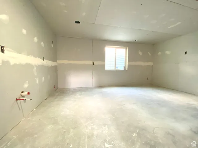 This can be a bedroom but it's now stubbed for a second kitchen with H/C and a drain. Flip them into the family room for a wet bar and make this a 6th bedroom.