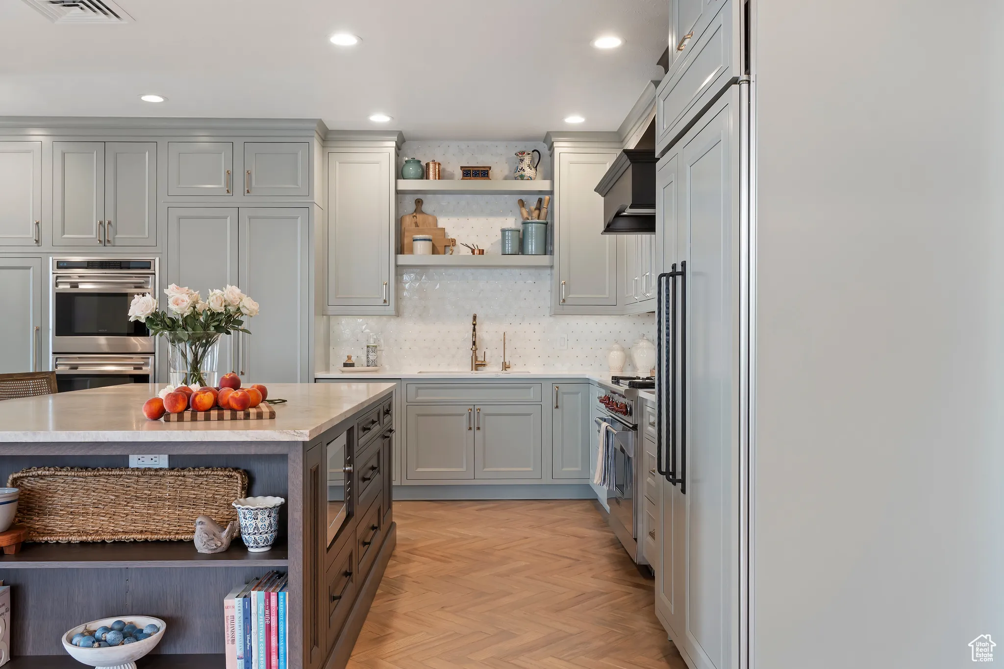 Kitchen featuring open shelves, backsplash, recessed lighting, stainless steel appliances, and gray cabinetry
