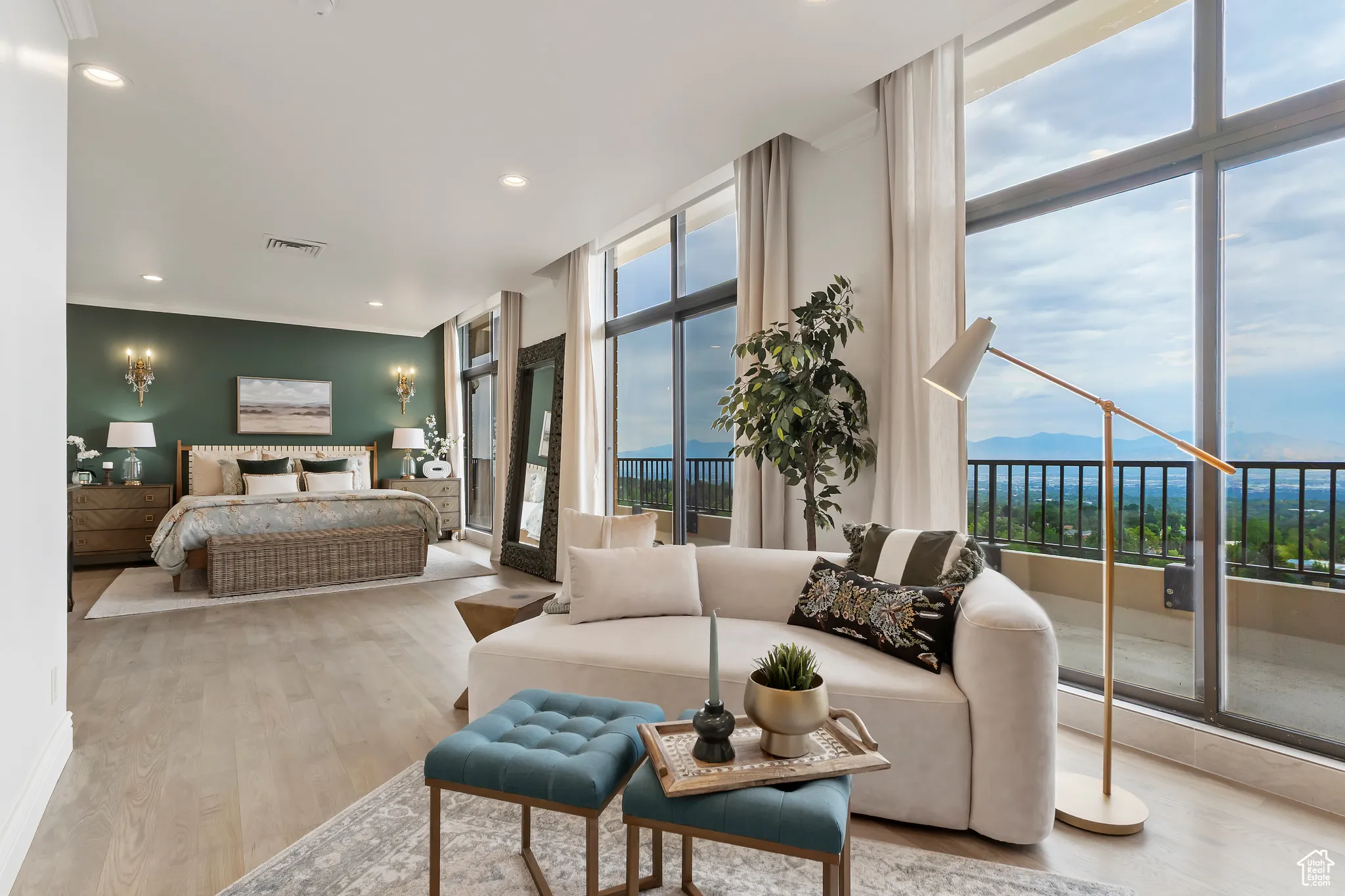 Bedroom with wood finished floors, recessed lighting, access to outside, expansive windows, and ornamental molding