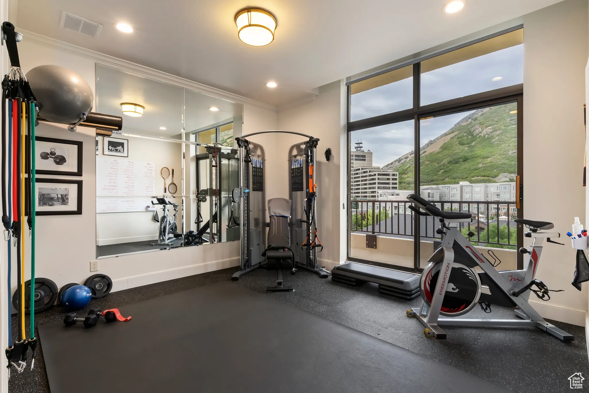 Exercise room featuring recessed lighting and ornamental molding