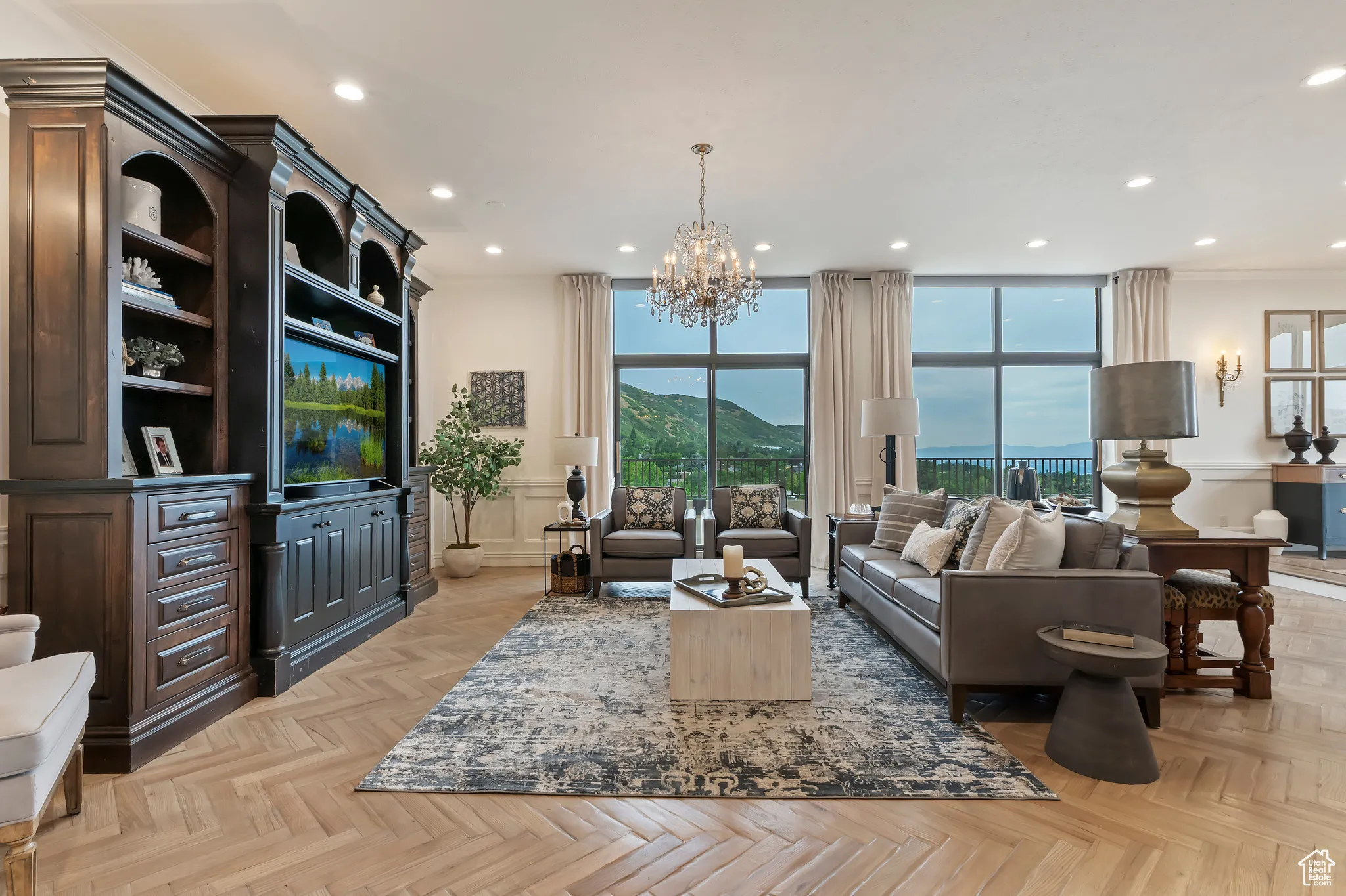 Living area with a chandelier and recessed lighting