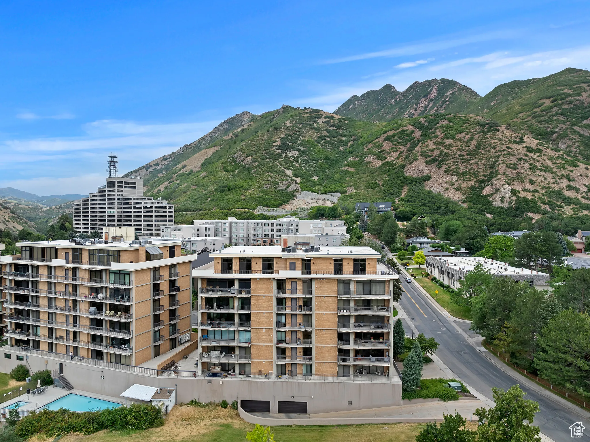 Drone / aerial view of mountains and apartment complex