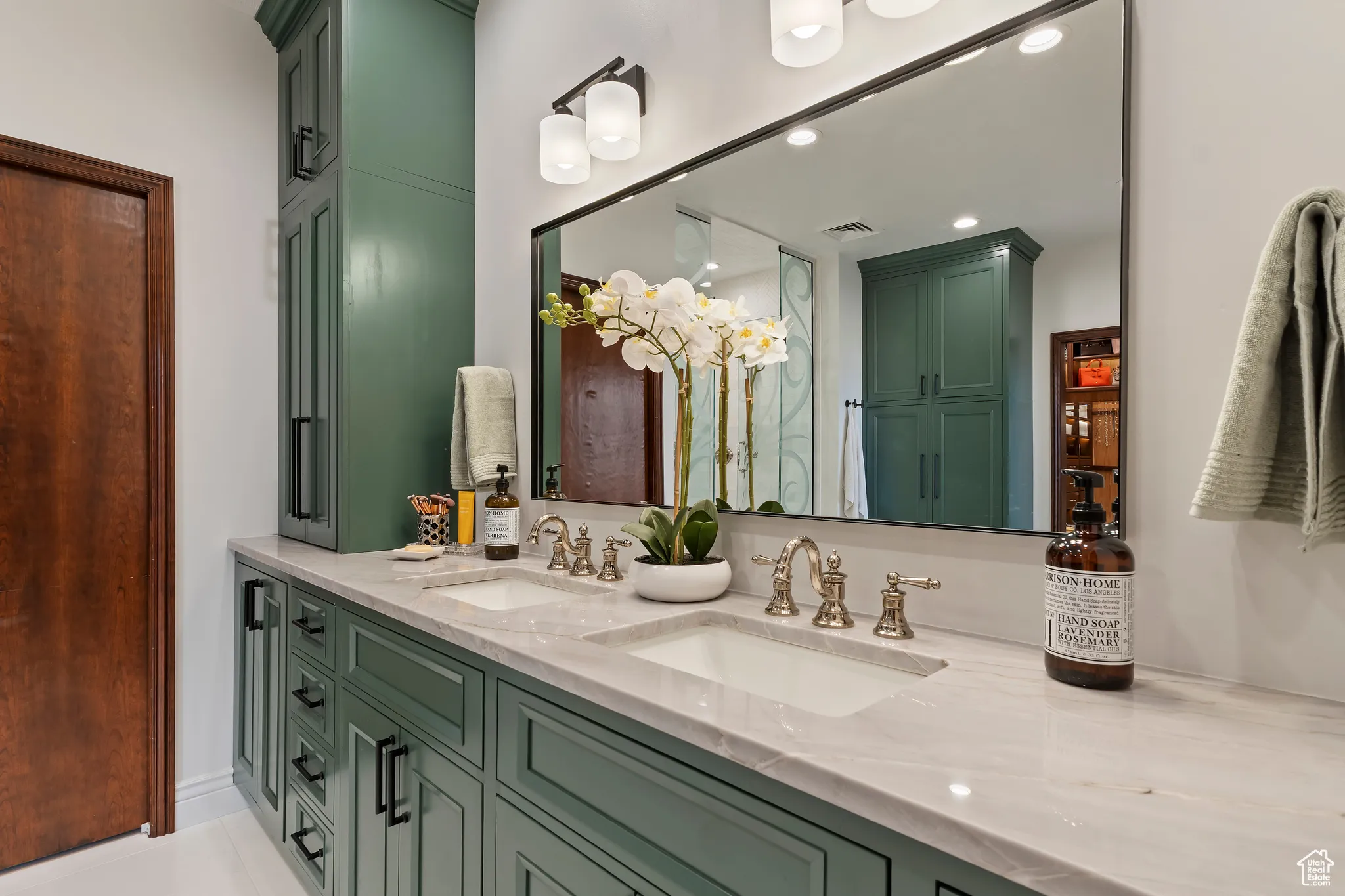 Bathroom featuring double vanity, recessed lighting, and tile patterned floors