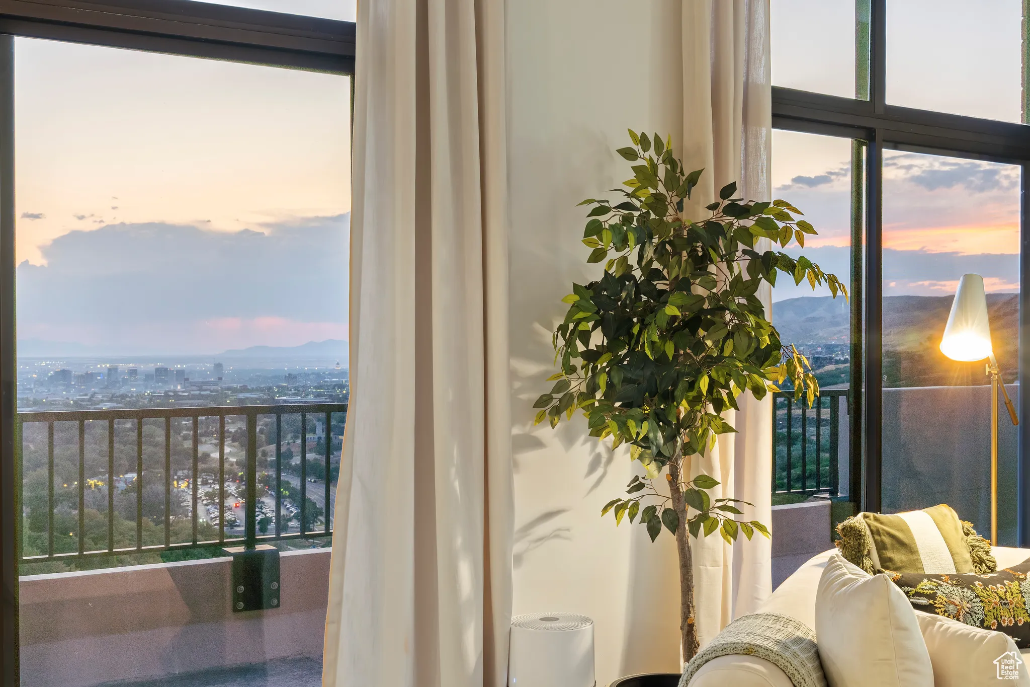 Balcony at dusk with a mountain view and a city view