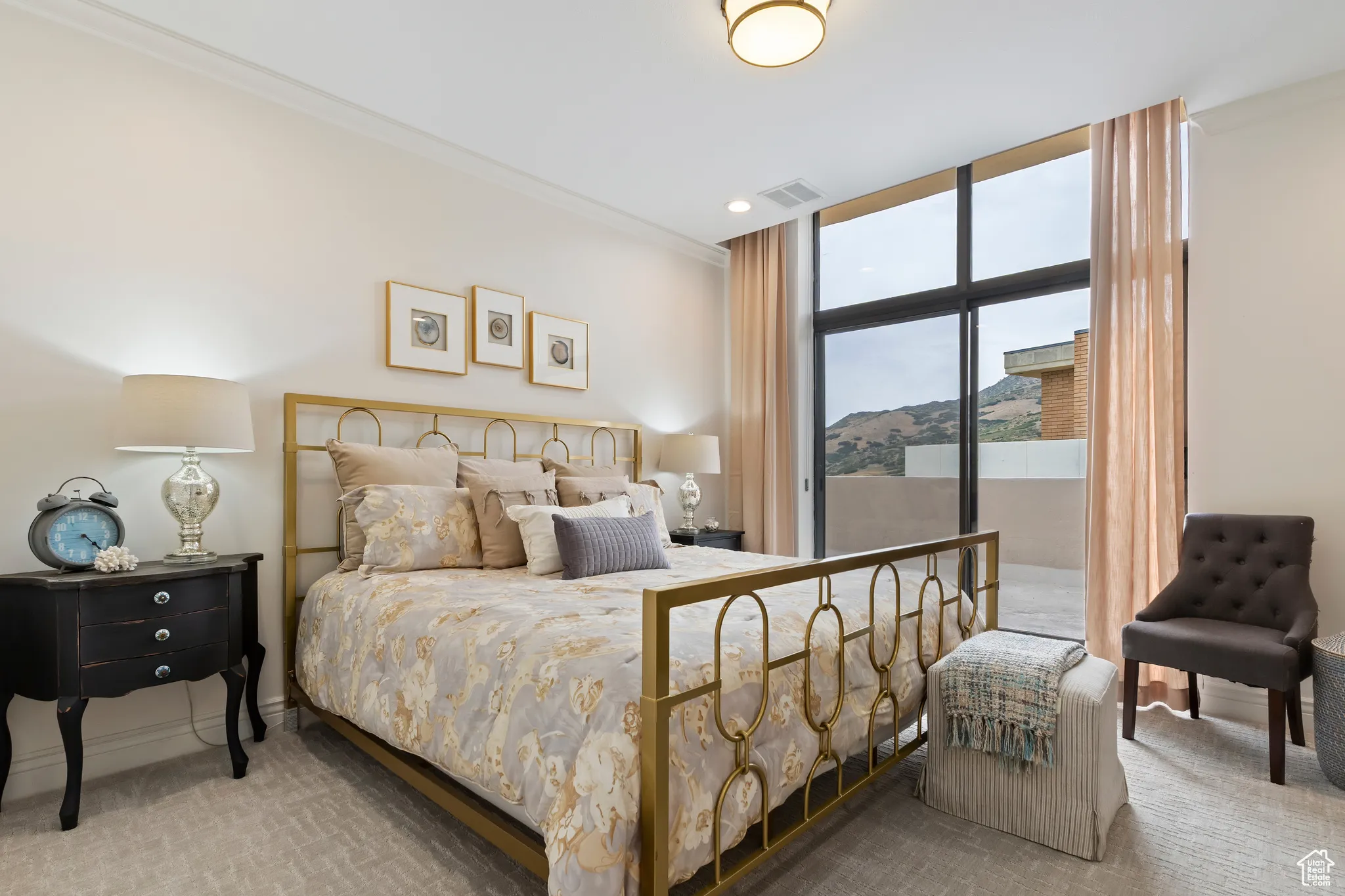 Bedroom featuring expansive windows, carpet flooring, recessed lighting, and access to exterior