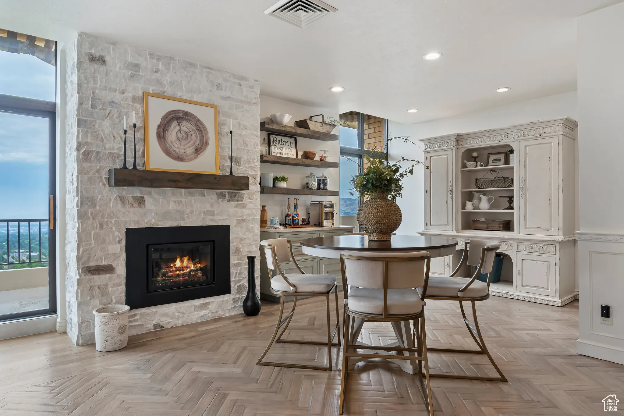 Dining space featuring a fireplace and recessed lighting