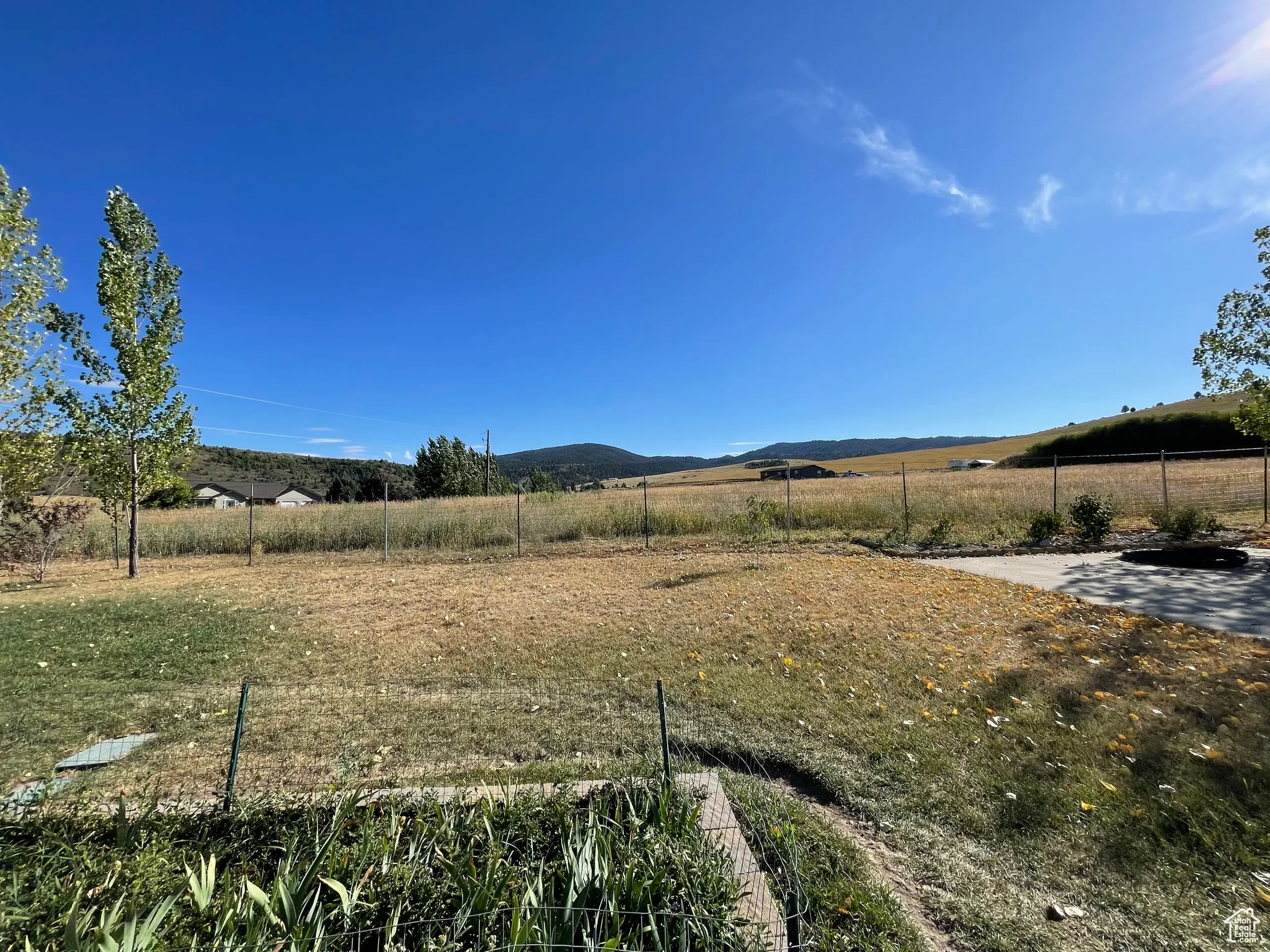View of yard with a view of countryside and a mountain view
