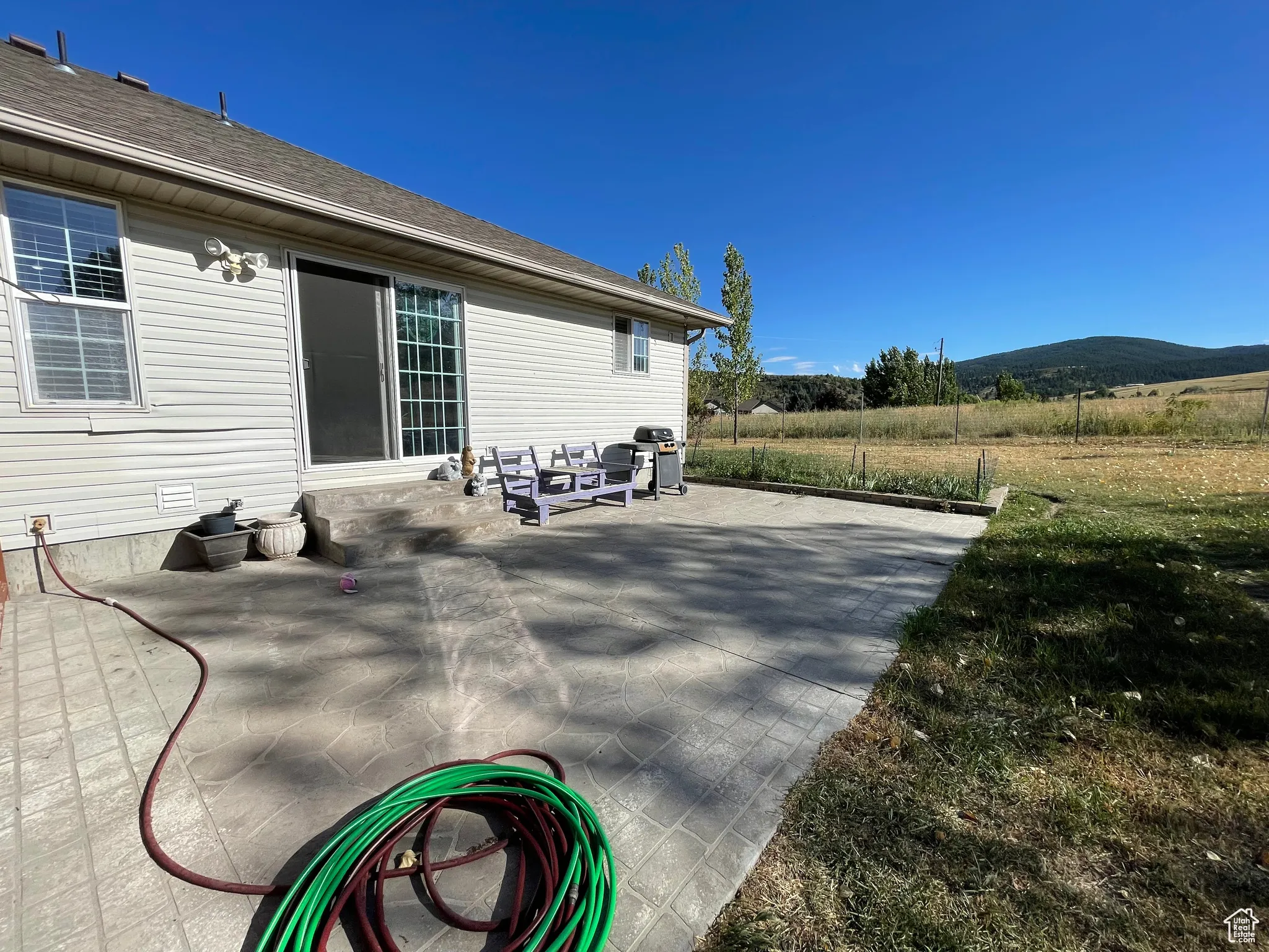 View of patio featuring area for grilling
