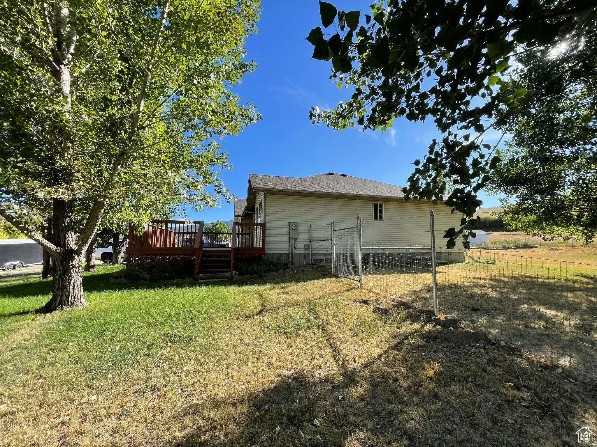 Rear view of property with a wooden deck