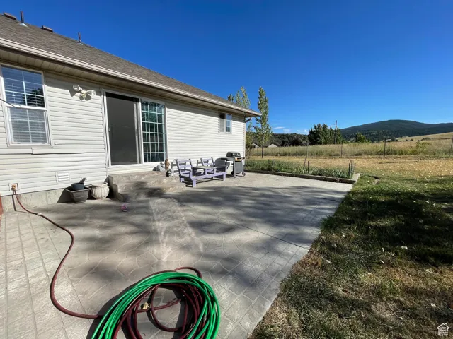 View of patio featuring area for grilling