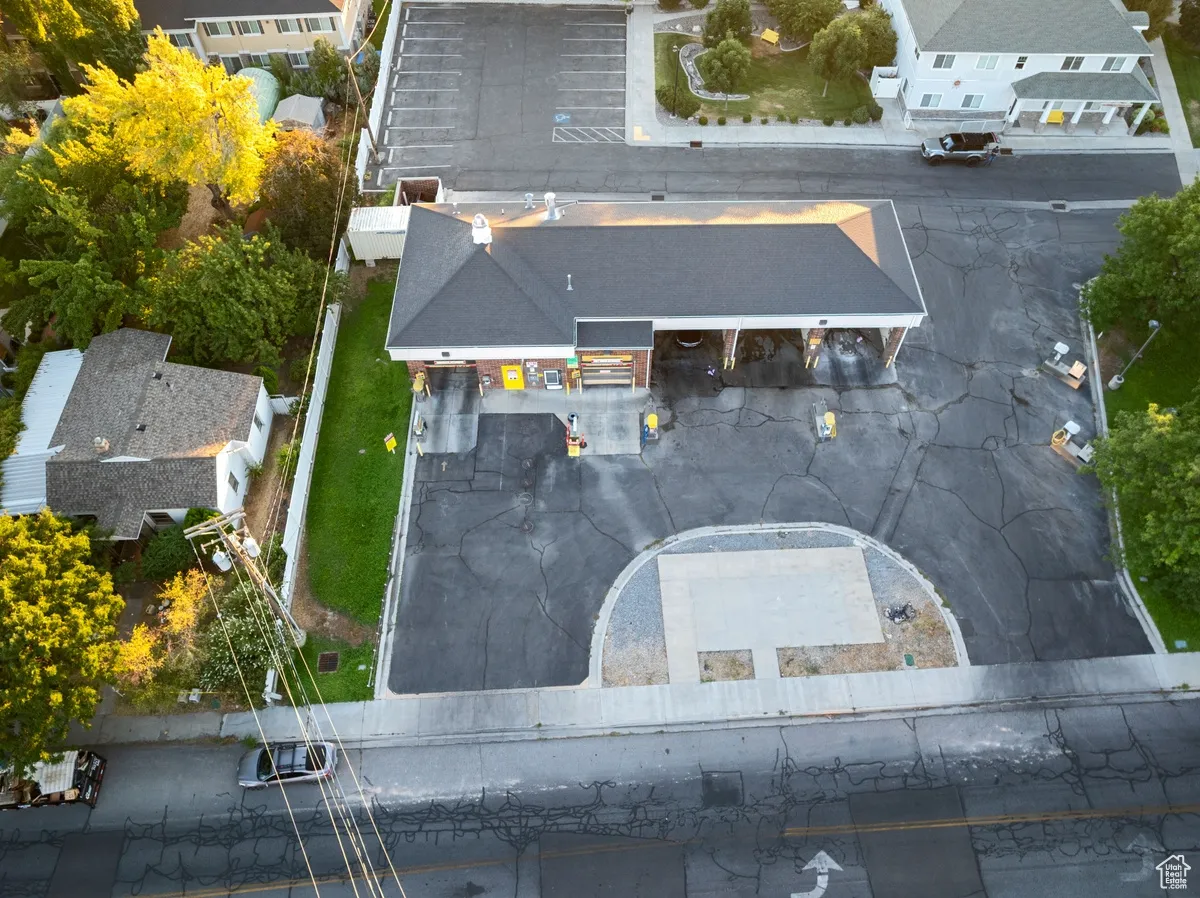 Aerial overview of property's location with nearby suburban area