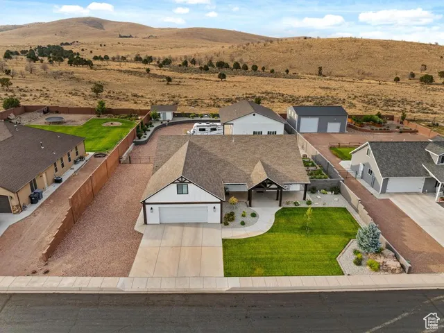Aerial perspective of suburban area with a mountainous background
