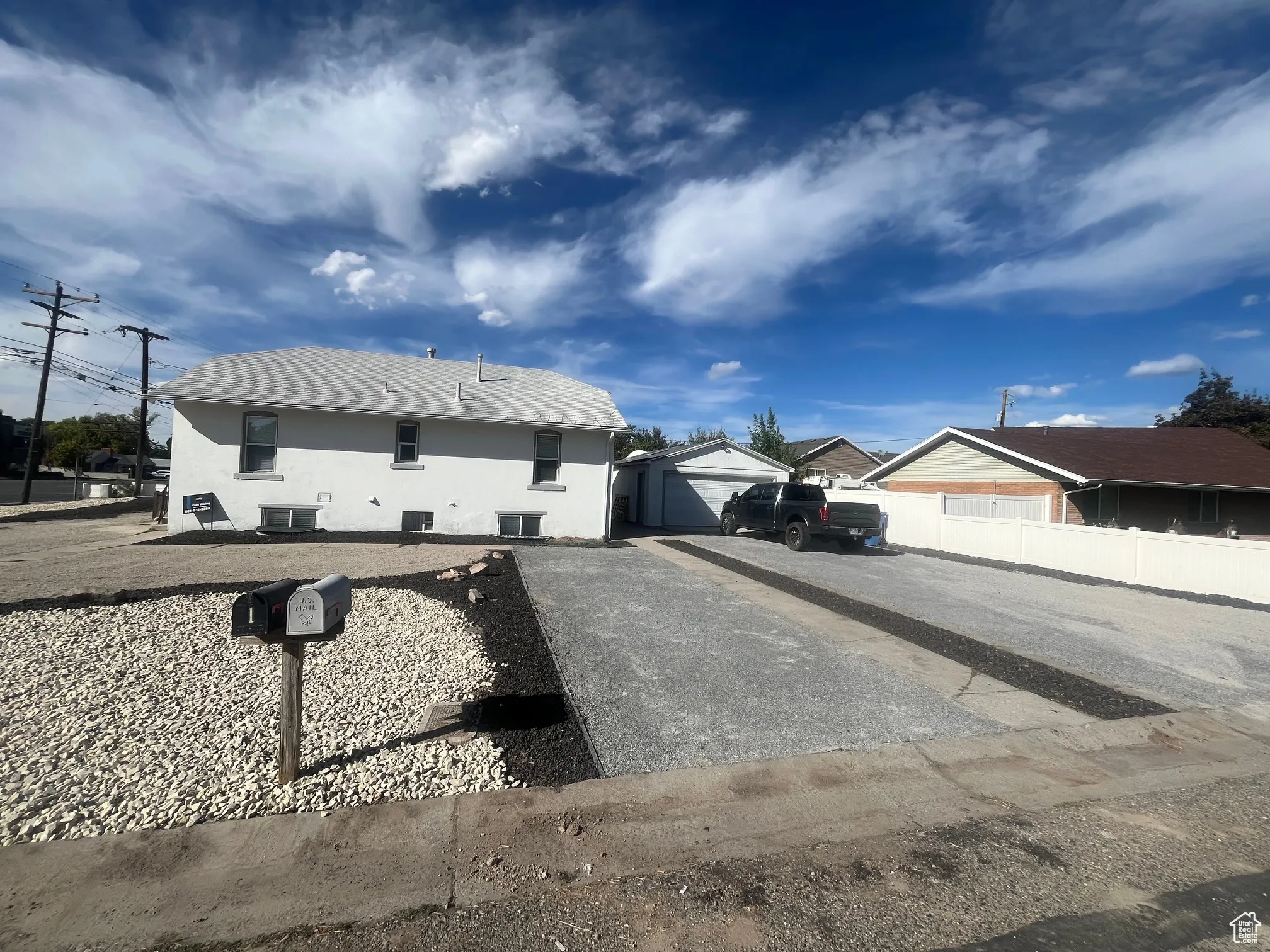 Ranch-style house with stucco siding