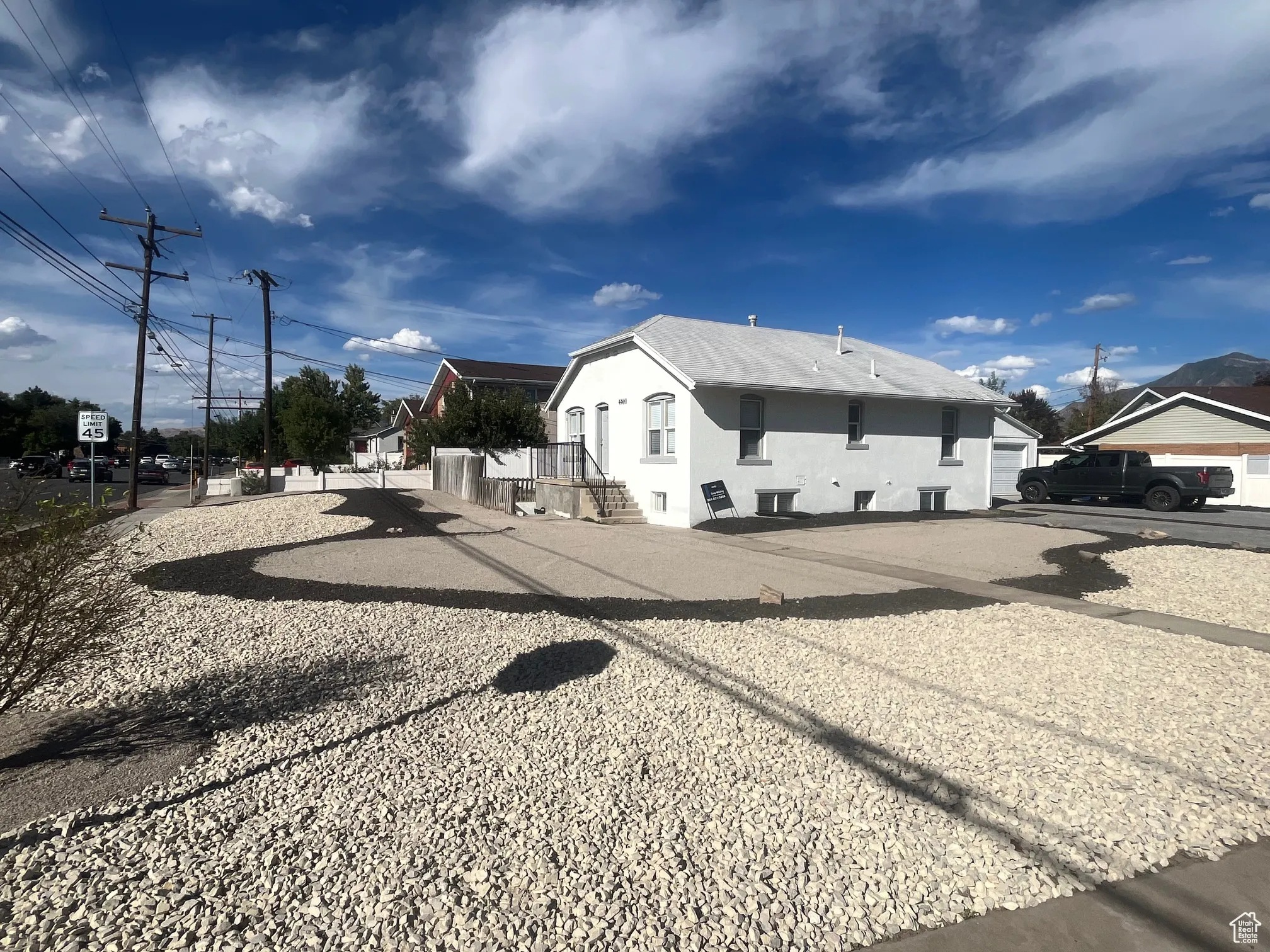 View of asphalt road with traffic signs