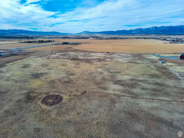 Aerial view of sparsely populated area featuring a mountainous background