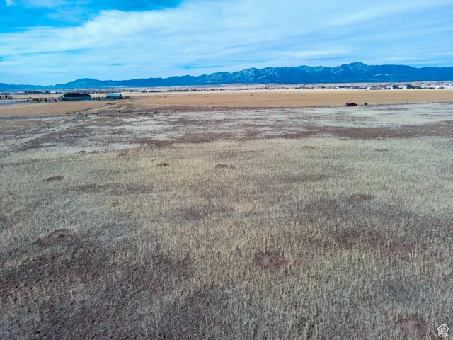 View of mountain background featuring rural landscape
