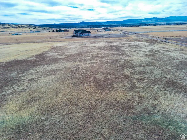 Aerial view of sparsely populated area with a mountain backdrop