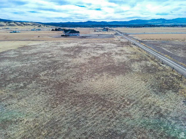 Aerial view of sparsely populated area featuring a mountainous background