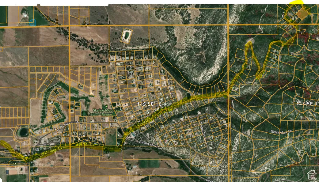 Aerial map of property and surrounding area with property boundaries highlighted