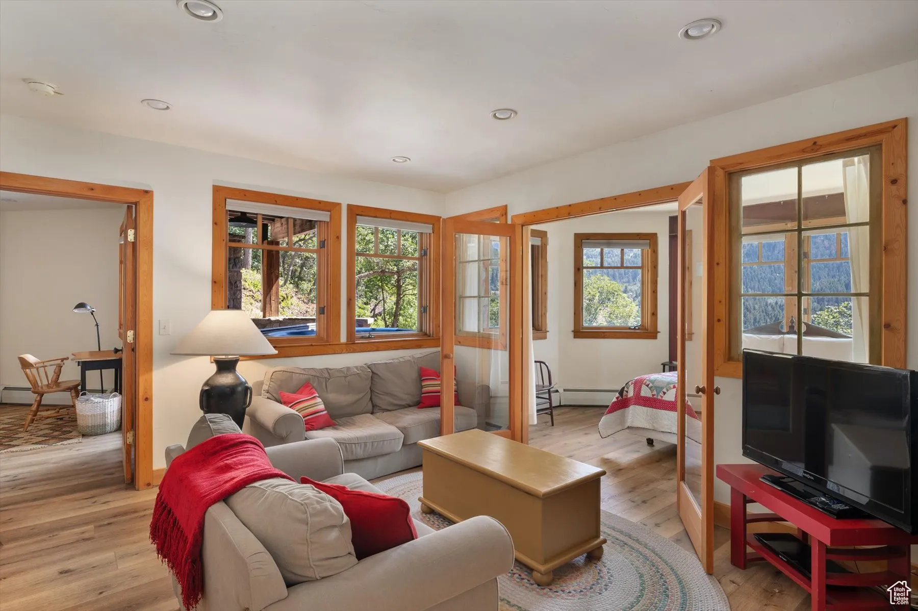 The lower level family room has a stone faced wood burning fireplace and offers wonderful views