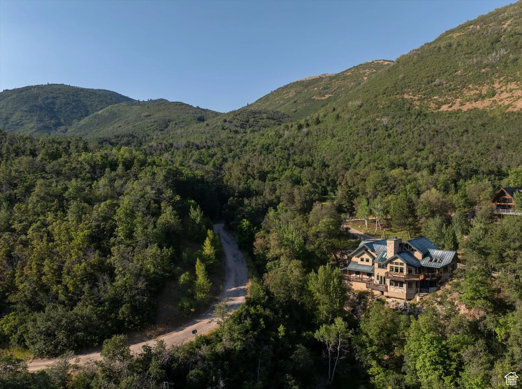 Rear view of the home with Ida Road to the left leading to Children's Road