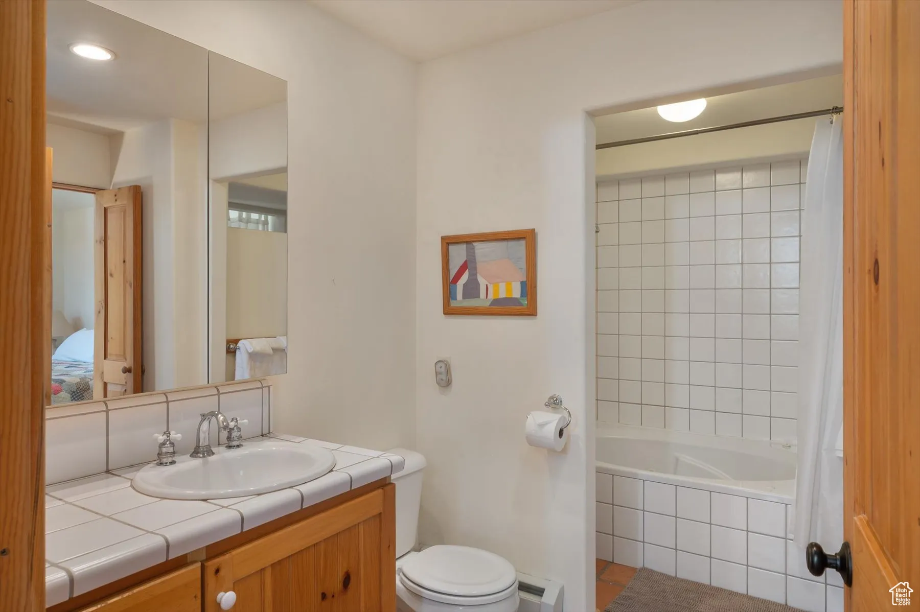 The en-suite full bath can be accessed from the primary bedrooms or from the great room. The floors are paved in Saltilllo tiles there is a jetted tub also