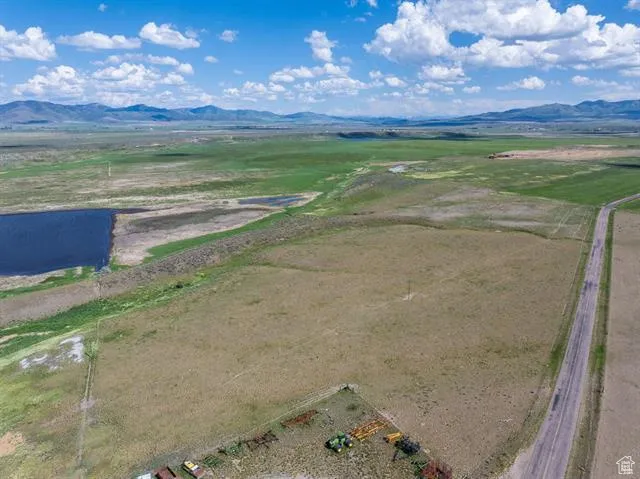 Overview of rural landscape featuring a mountain backdrop