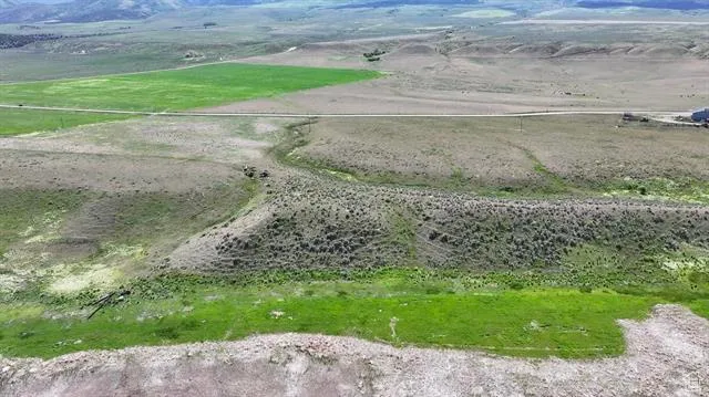 Overview of rural landscape with a mountain backdrop