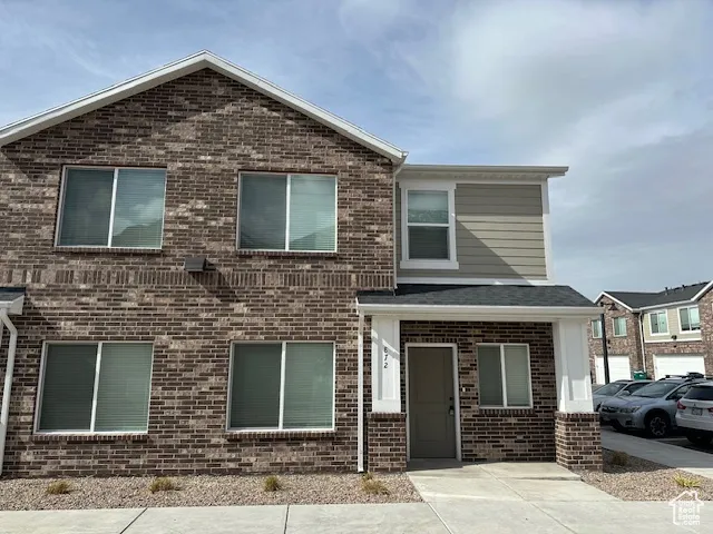 View of front of home with brick siding