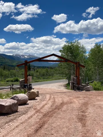 View of property's community featuring a view of trees and a mountain view