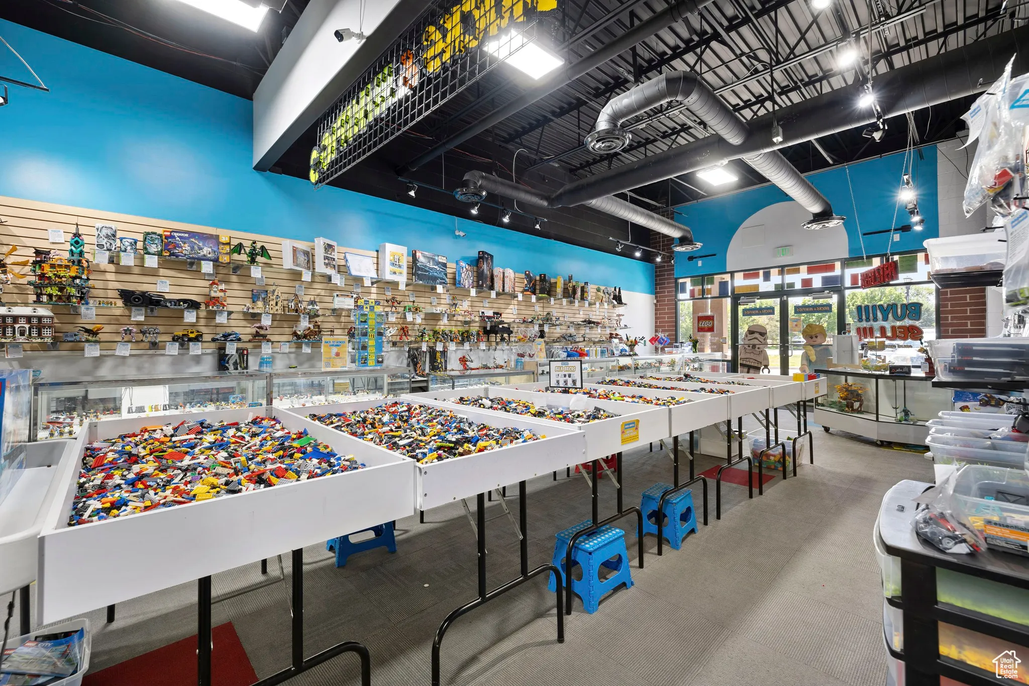 Miscellaneous room with a towering ceiling
