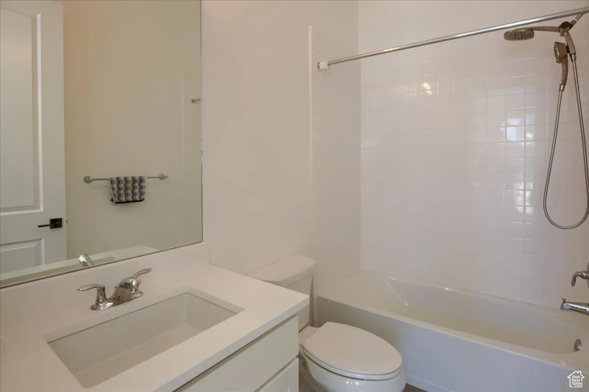 Bathroom with shower / bathtub combination and vanity
