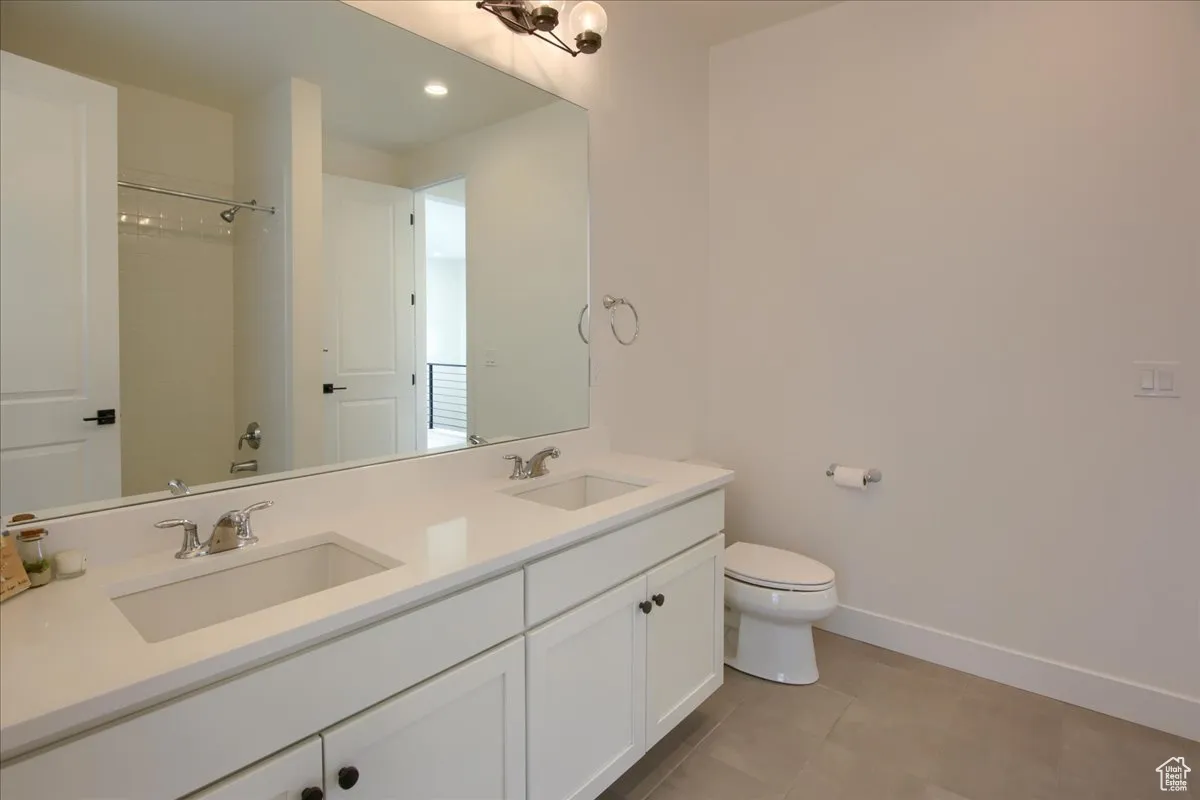 Full bath featuring light tile patterned floors, recessed lighting, and a shower