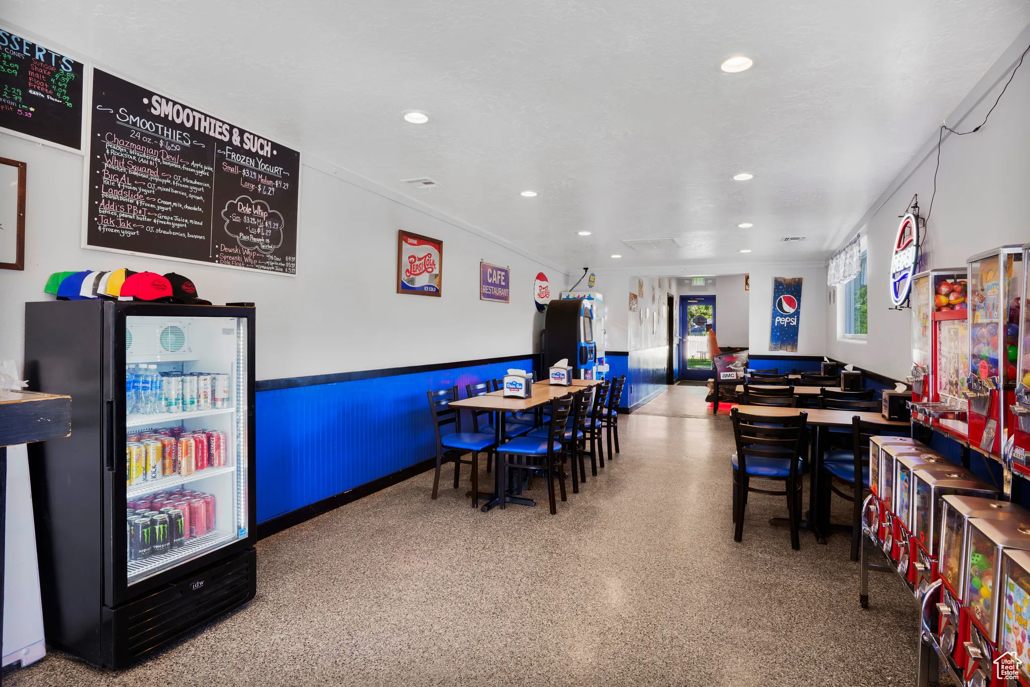 Playroom with recessed lighting and a wainscoted wall