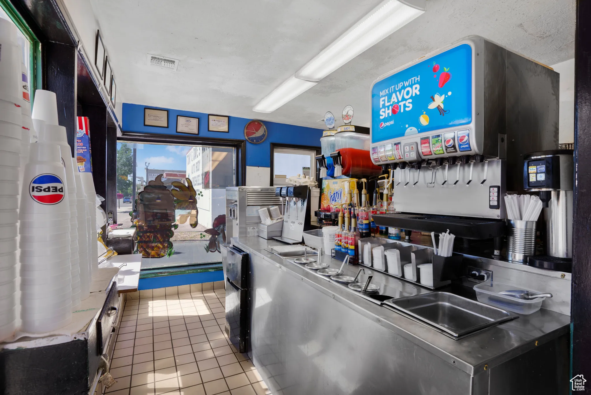Kitchen featuring tile patterned floors and refrigerator