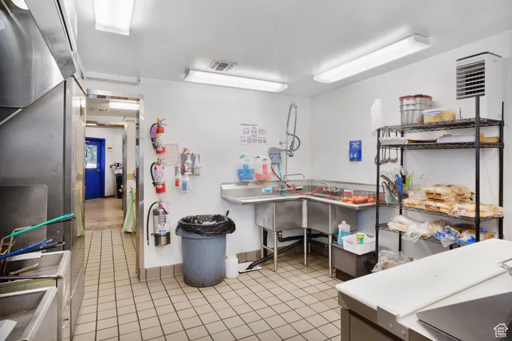 Kitchen featuring light tile patterned floors