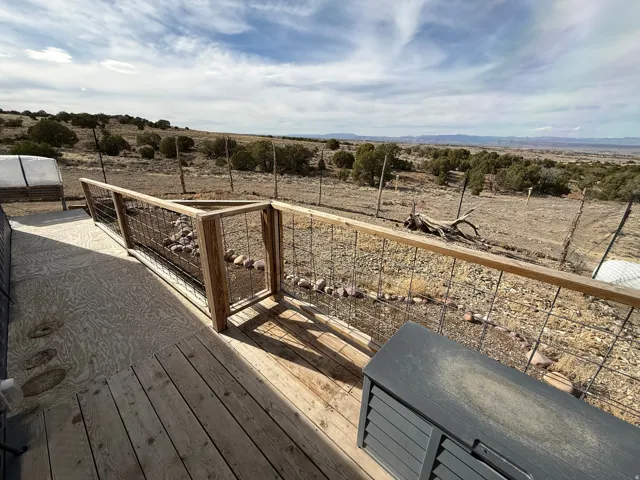 Wooden deck featuring a rural view